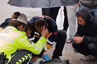 İnegöl'de içleri ısıtan anlar! İçişleri Bakanı Çiftçi'den yaralı gence şemsiye tutan trafik polisi Şerife Nur Can'a teşekkür